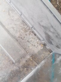 Leftover food bits in freezer.