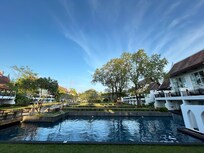 Adult accommodation surrounds the pool and park area