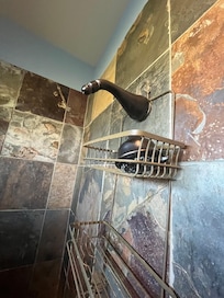 Missing shower head in master bath head that comes out of ceiling so covered in lime didn’t work either