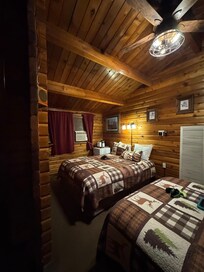 Room we stayed in with two queen beds with a bathroom and small fridge.