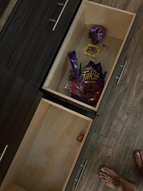 Drawers in the room filled with old trash where room had not been properly cleaned