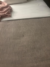 If you zoom in you can see cigarette burns.