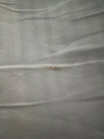 Brown streak on sheet.