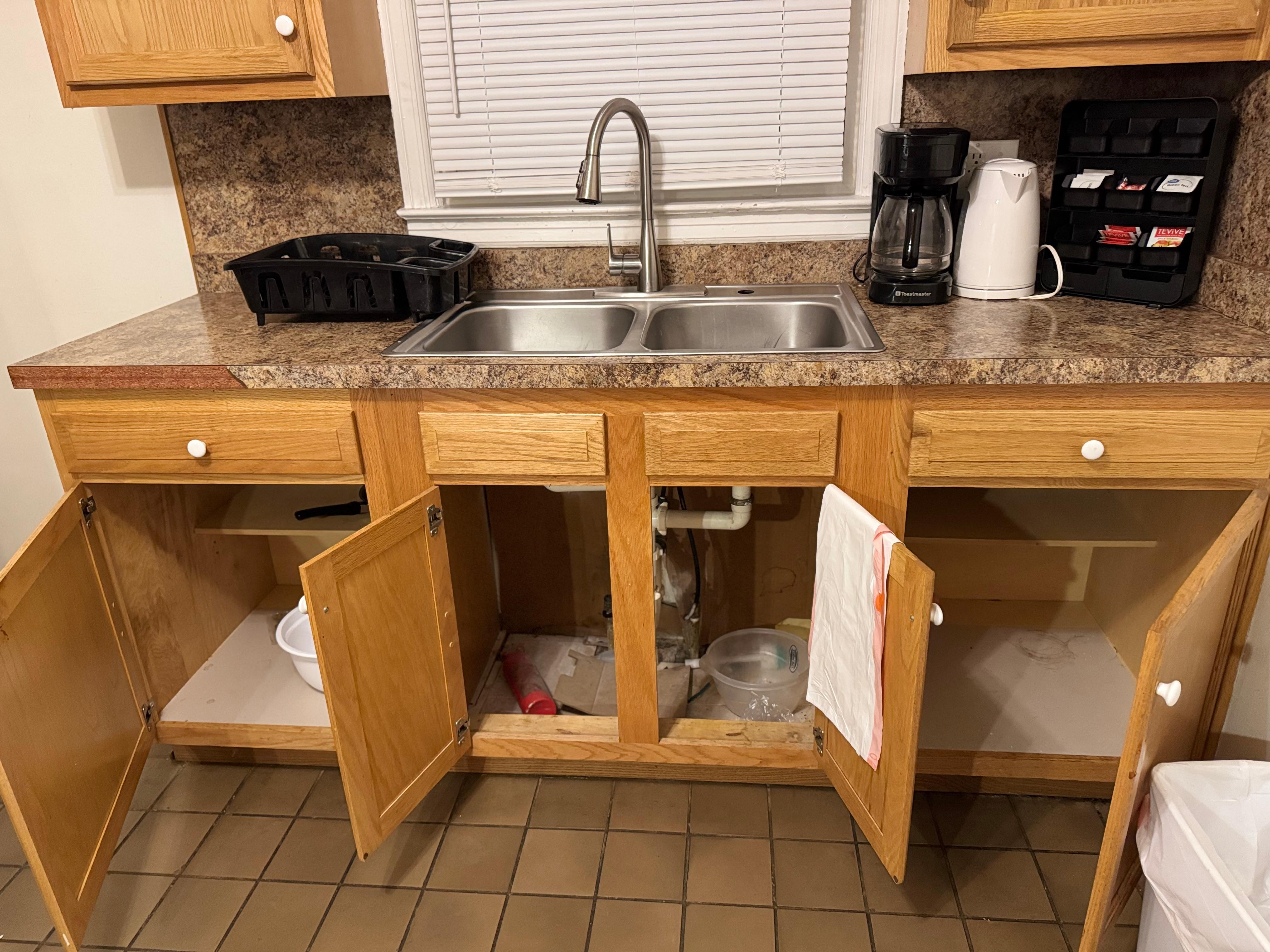 Dirty cupboards everywhere with trash and food crumbs/stains in them.  The fire extinguisher laying in this cupboard was too dirty to touch 