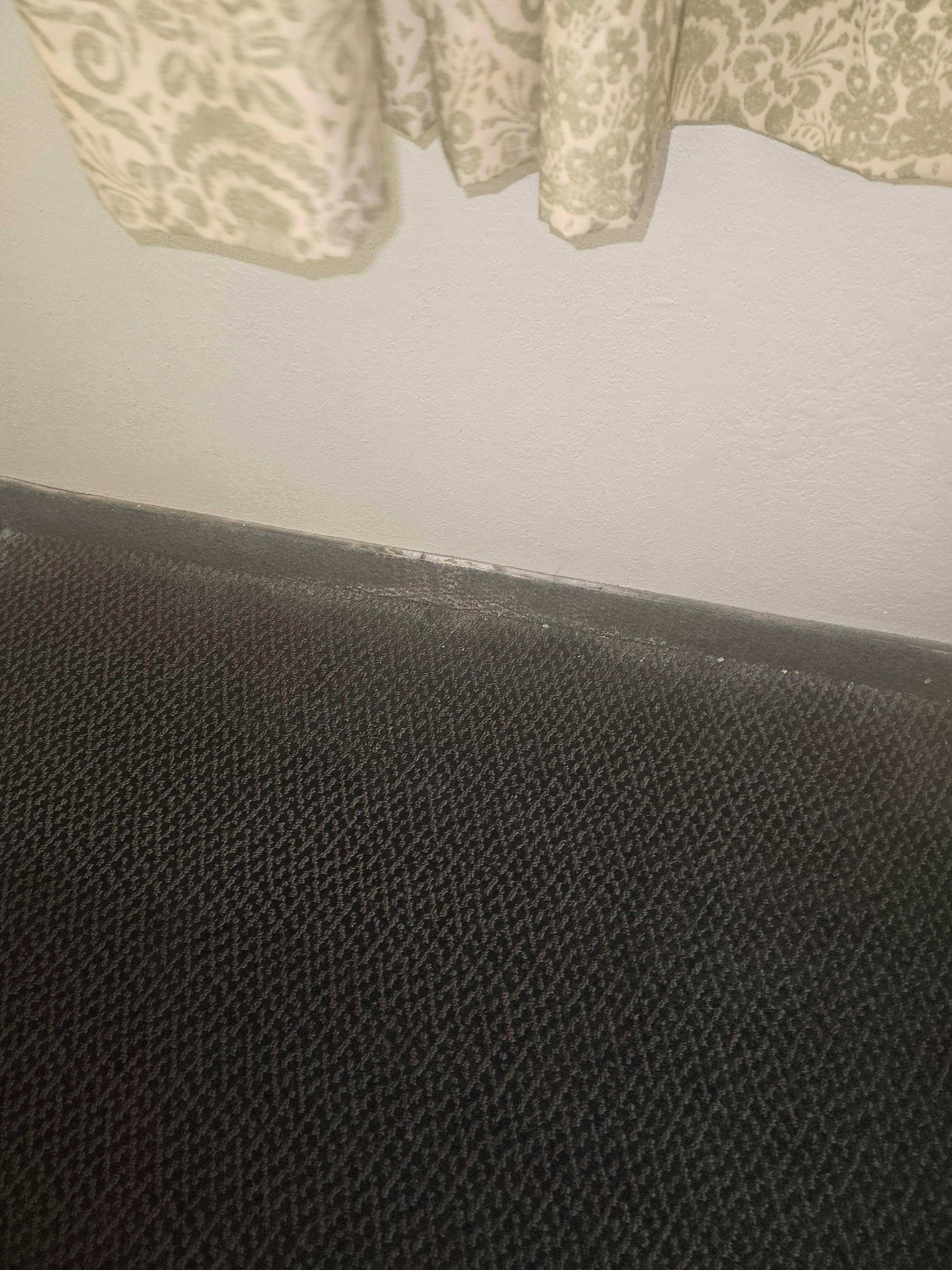 Stains on the wall and smelly carpet
