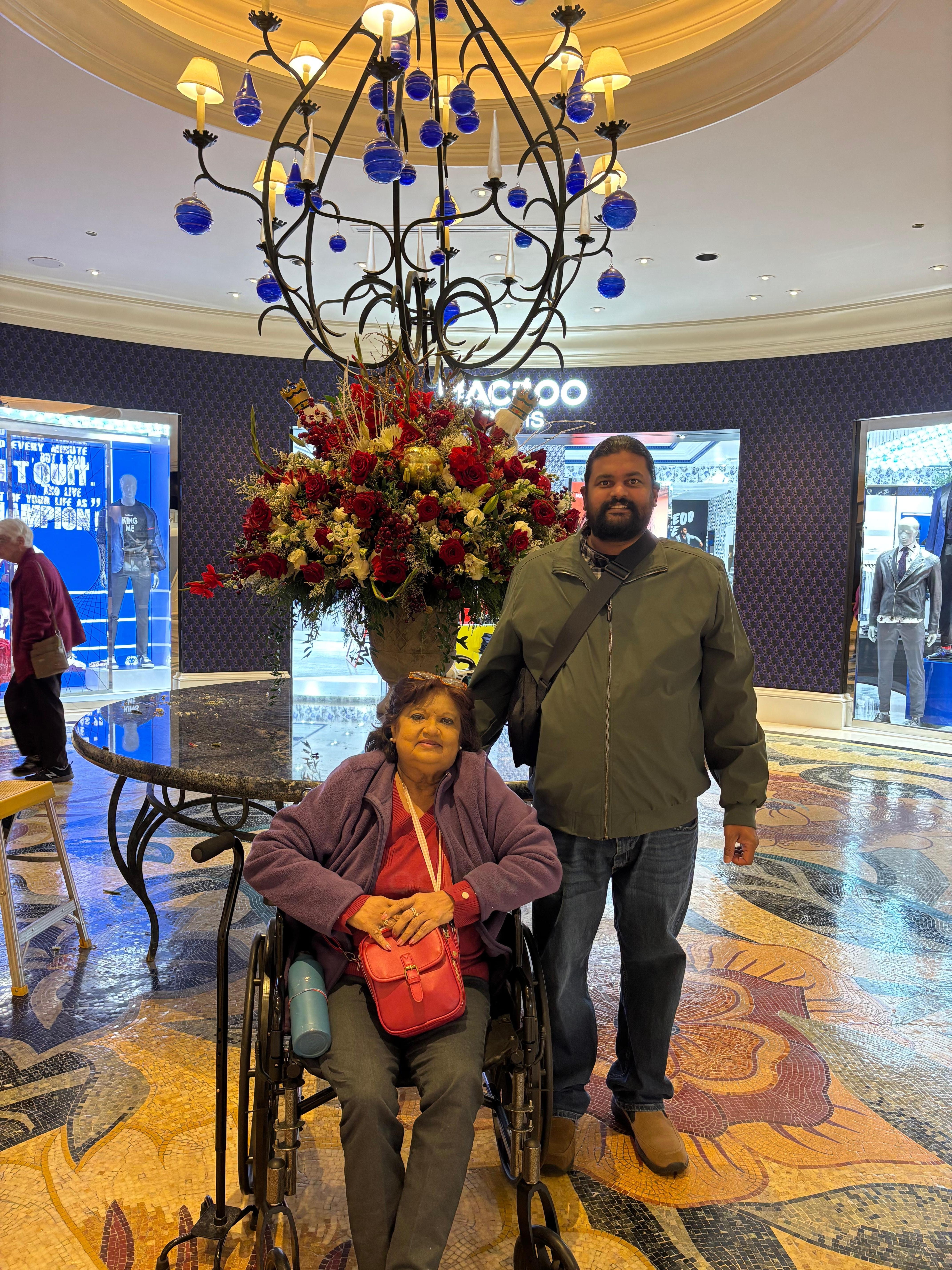 The person doing maintenance on these flowers was so nice and was happy to take this picture of me and my mom