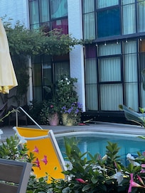 Outdoor pool view toward rooms.