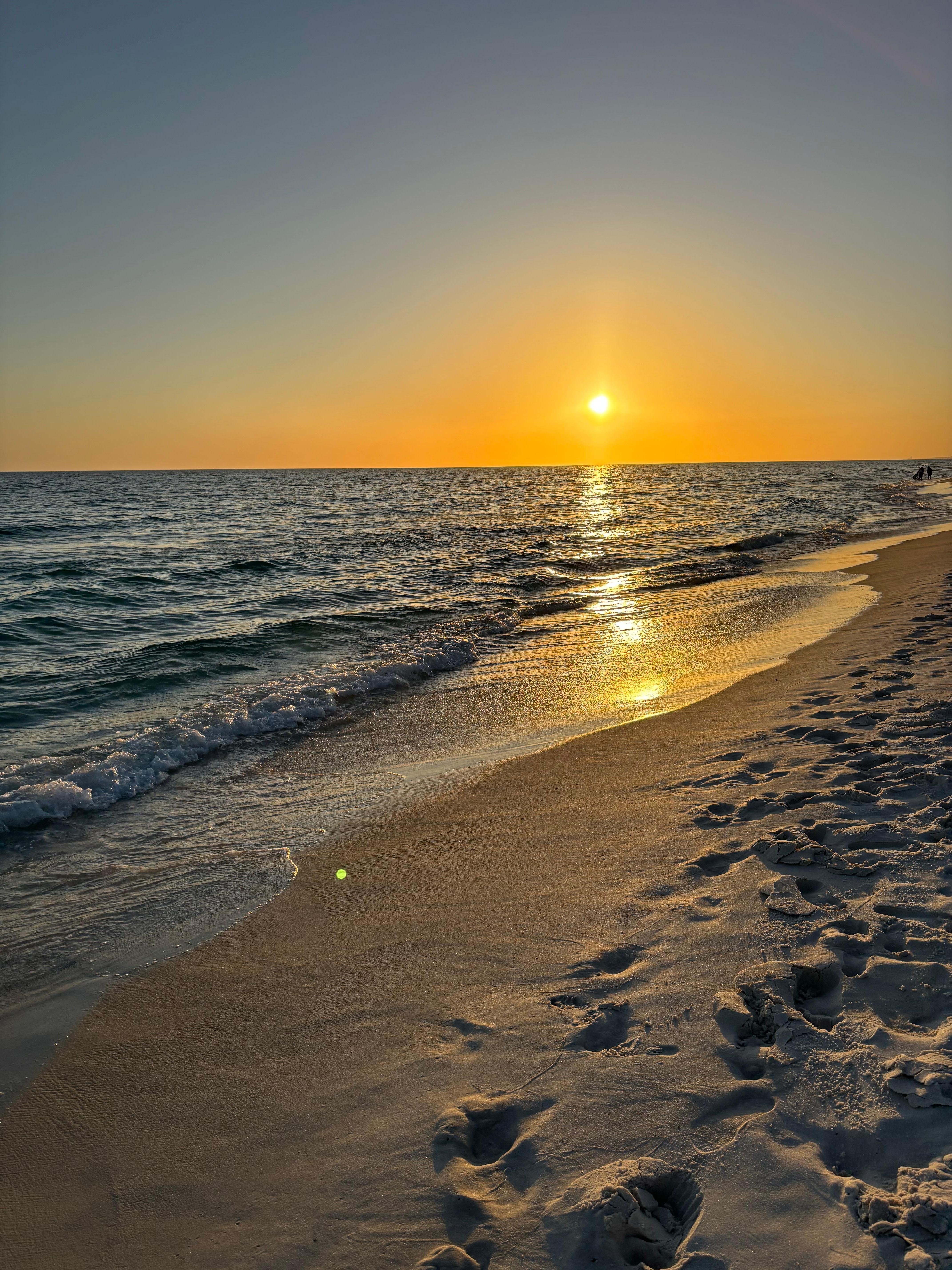 Breathtaking sunset from the beach directly in front of the home.