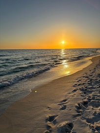 Breathtaking sunset from the beach directly in front of the home.