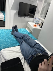 No sofa and very close to the TV.