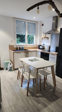 Kitchen-Oven, stove, dishwasher, refrigerator, and cooking and serving dishes/utensils. (no microwave)