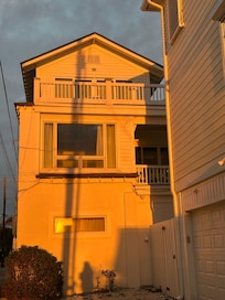 The window of the room I stayed in with the glow from the sunrise.