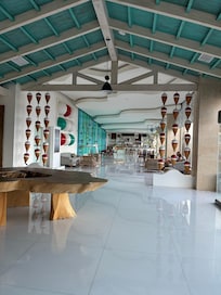 Area to the right of check in. Sitting area and bar.