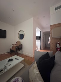 Living area with bedroom to the left.