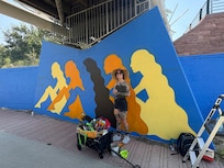 Artist, painting, a mural and comments Park