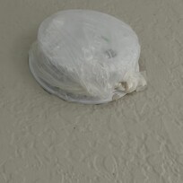Smoke detector wrapped in a plastic bag, I don't know why.