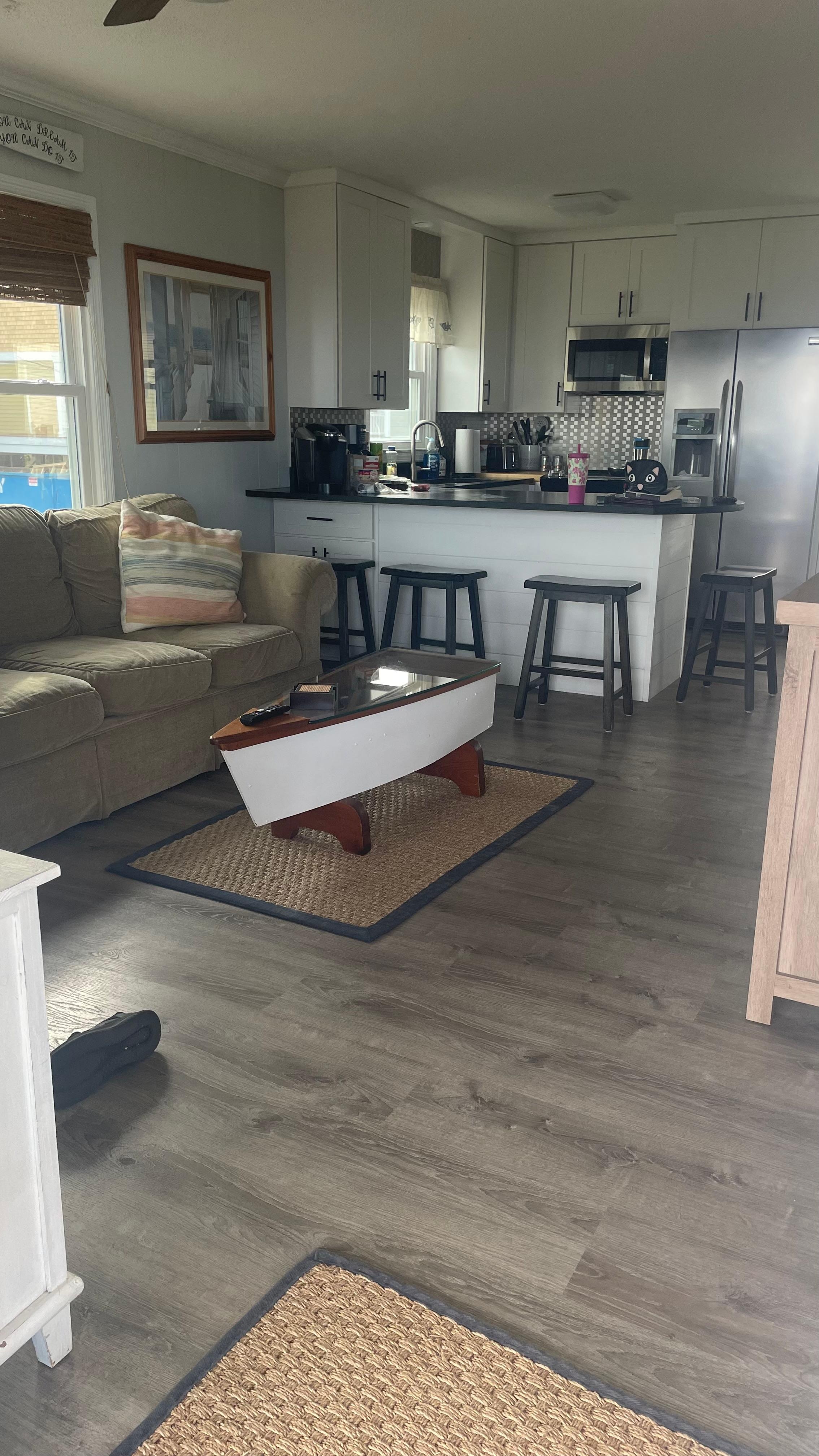 Most of my inside pics had people in them.  This doesn’t do it justice but only shot I had    There is a comfy couch and a recliner in the living room. 