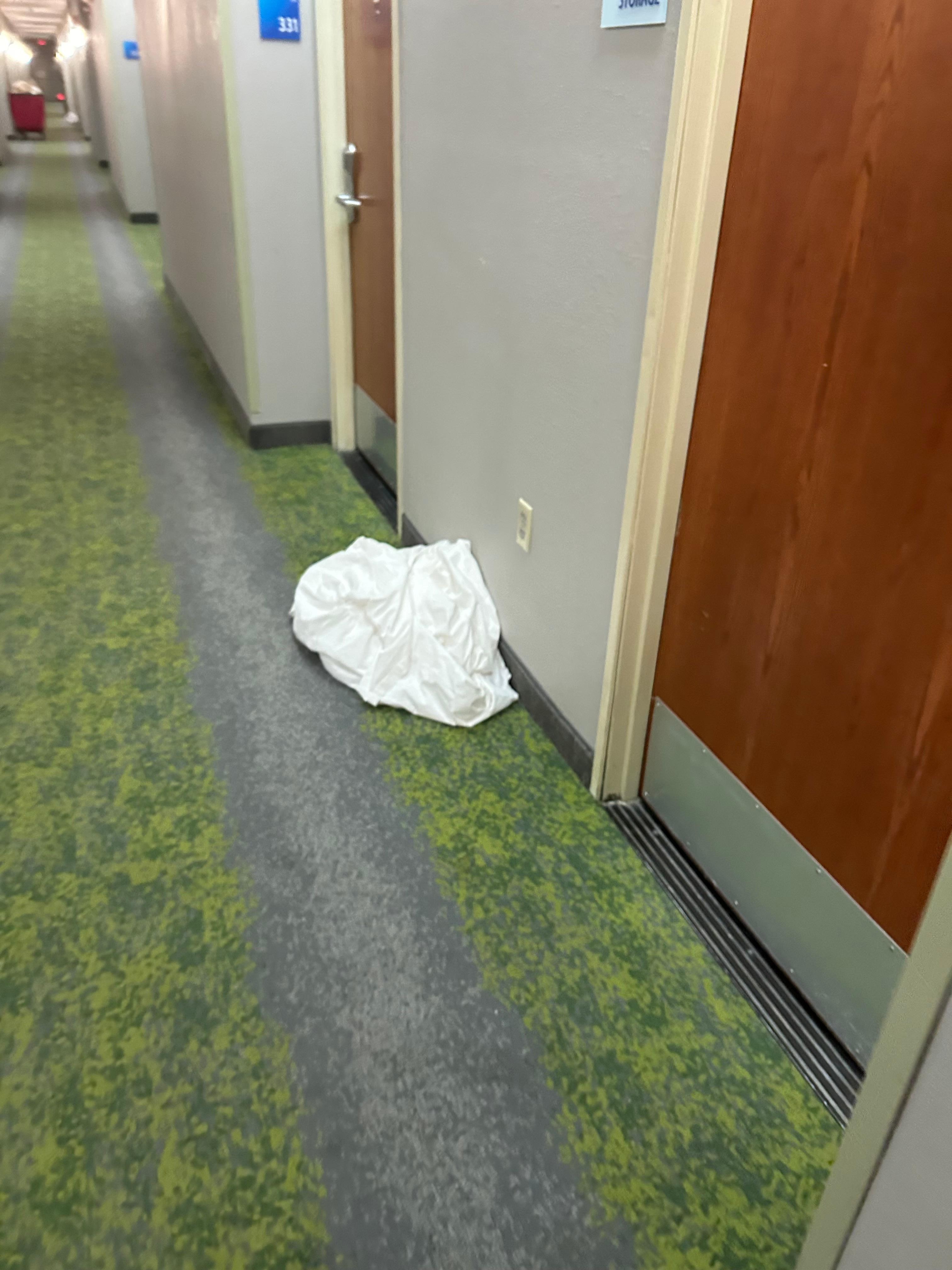 Dirty sheets in the hallway