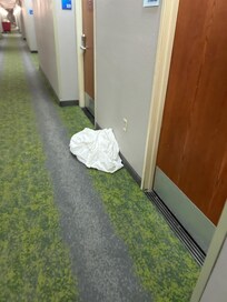 Dirty sheets in the hallway