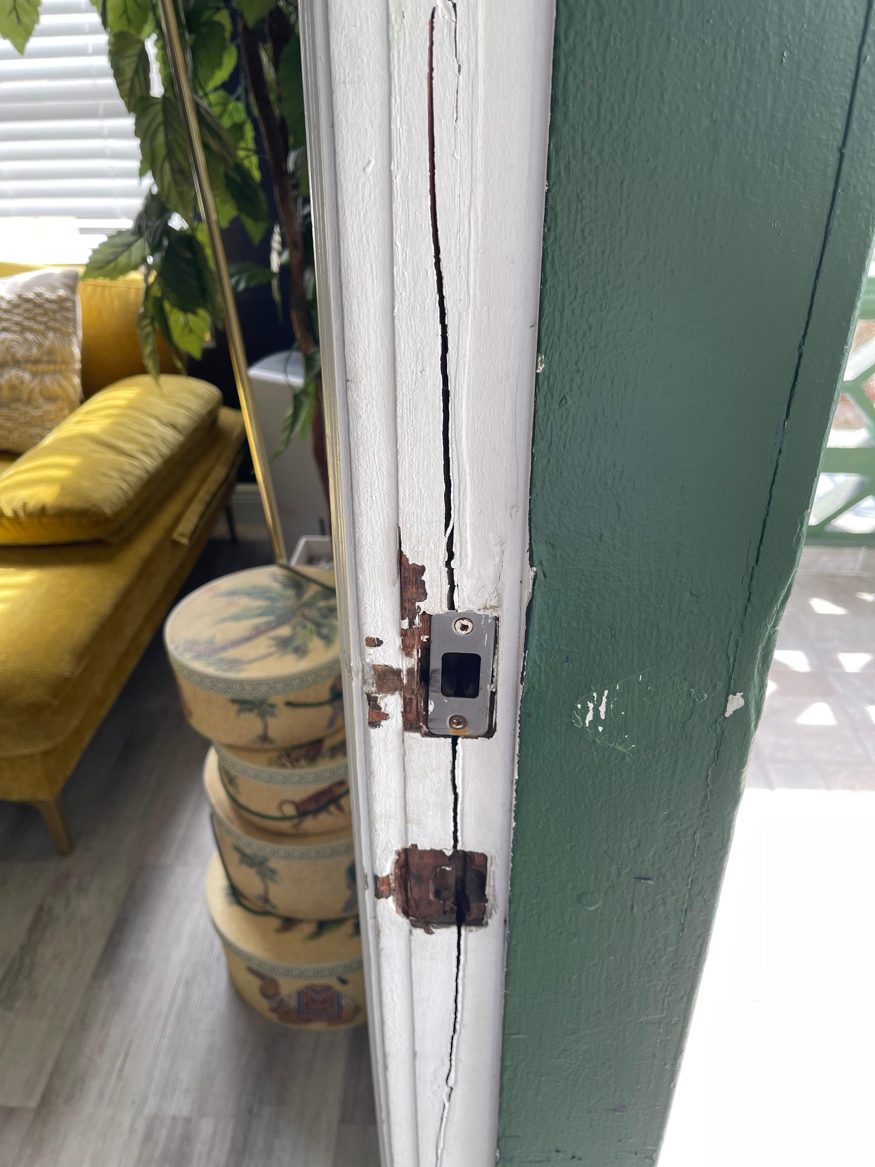 Door frame of front door, as if someone has tried to break it down