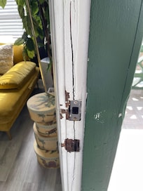 Door frame of front door, as if someone has tried to break it down