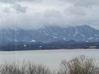 Snow on the mountains view from pool deck