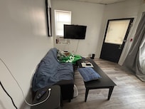 Living room has a couch and a daybed now! And everyone can face the Tv