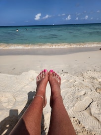 On the beach in front of the hotel.