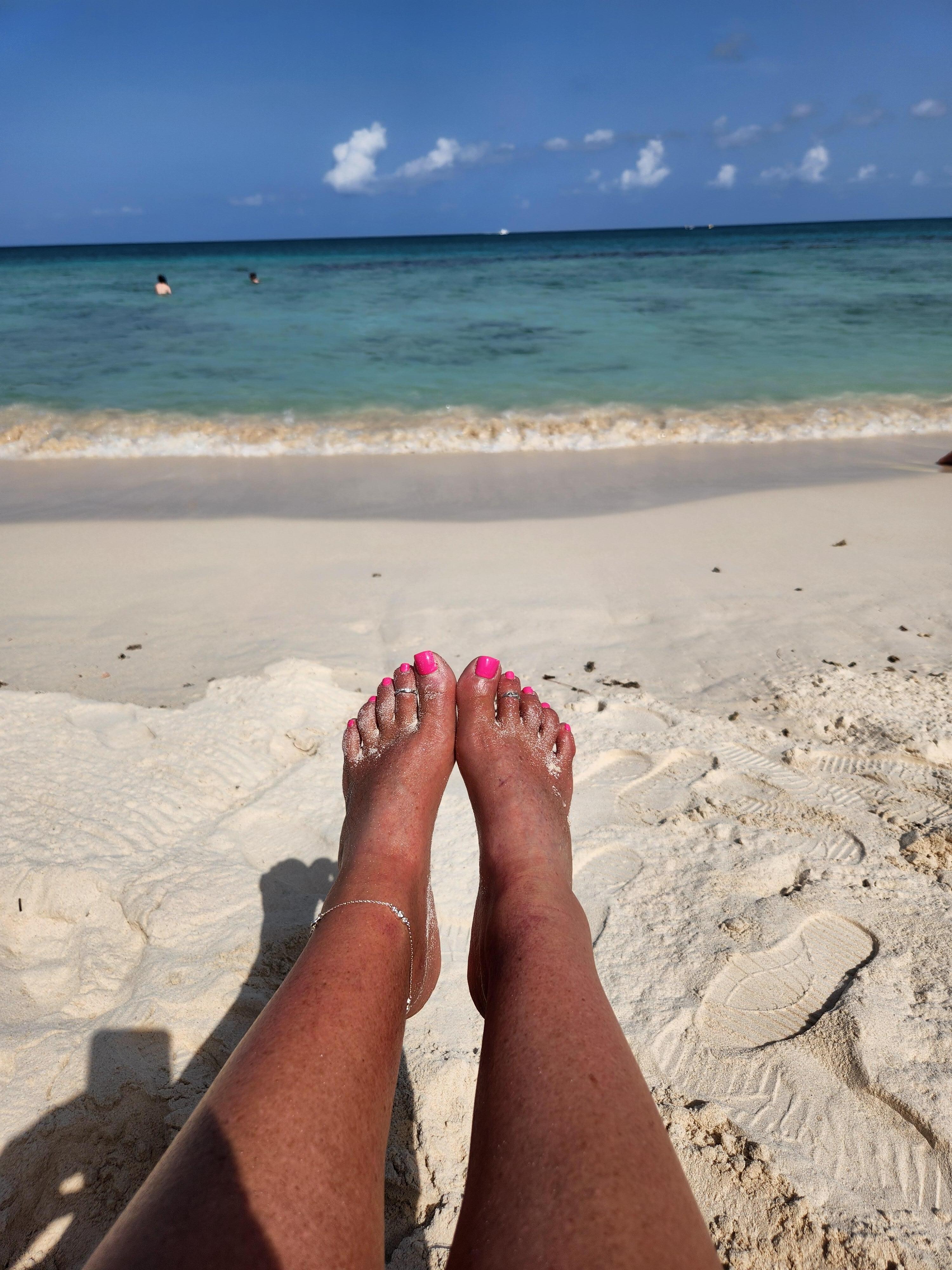 On the beach in front of the hotel.