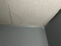 Ceiling in the bathroom above the toilet