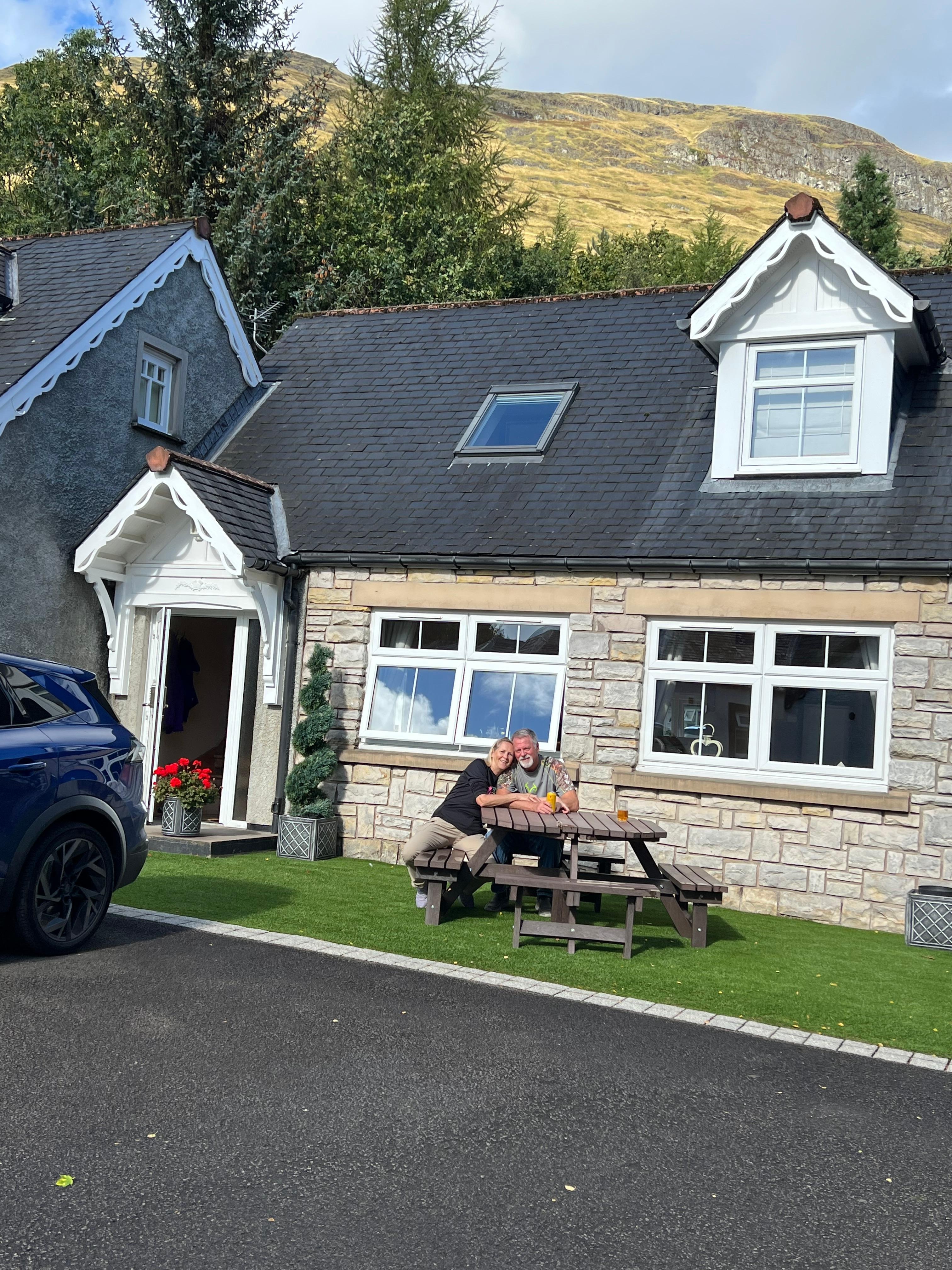 Enjoying a sunny day in front of Rowan cottage.