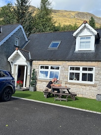 Enjoying a sunny day in front of Rowan cottage.