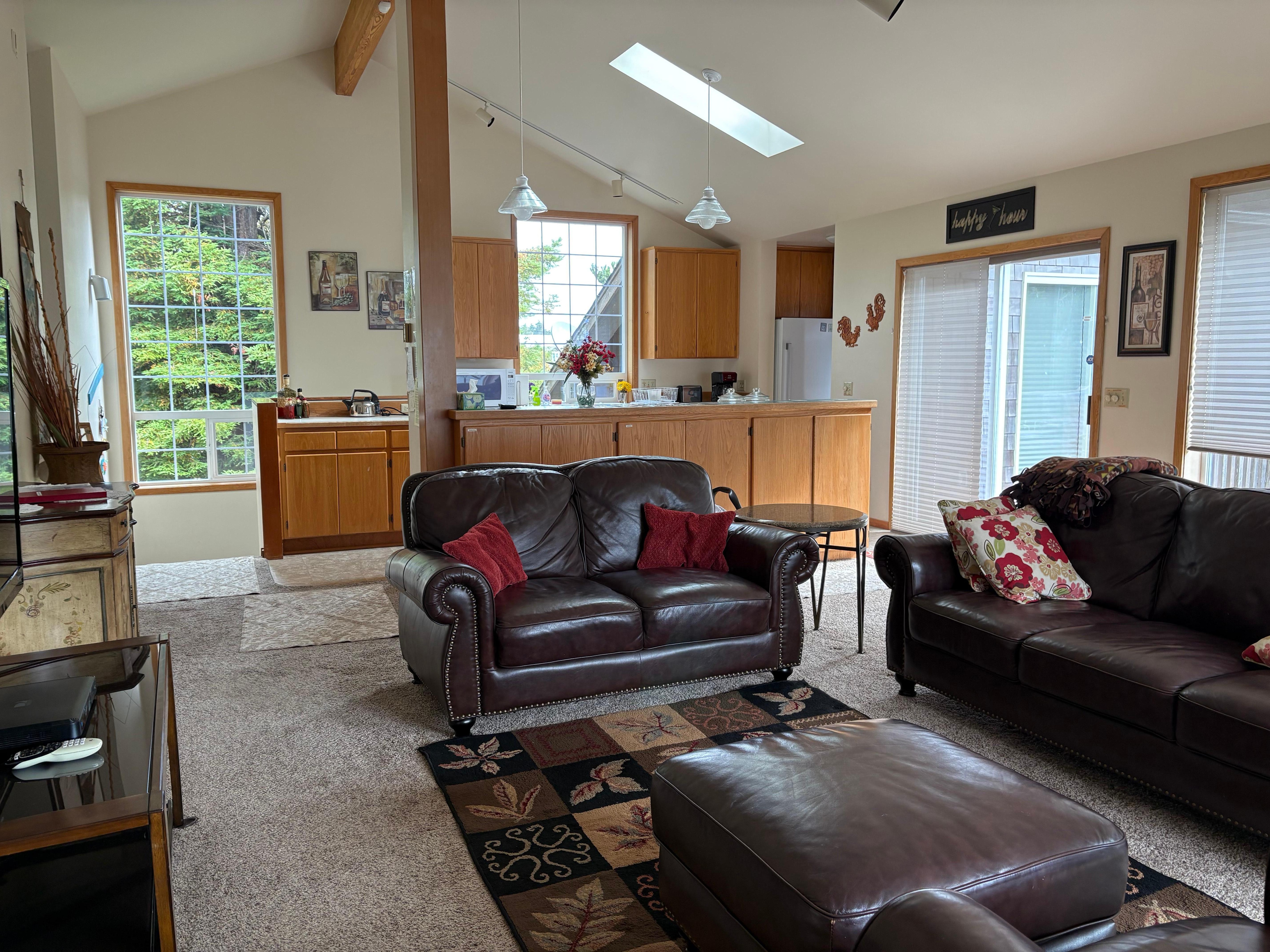 Living room into the kitchen/stairs down to the first floor (where rooms are and the outside door).