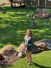 Our granddaughter feeding the 5 deer gathered on the property.....