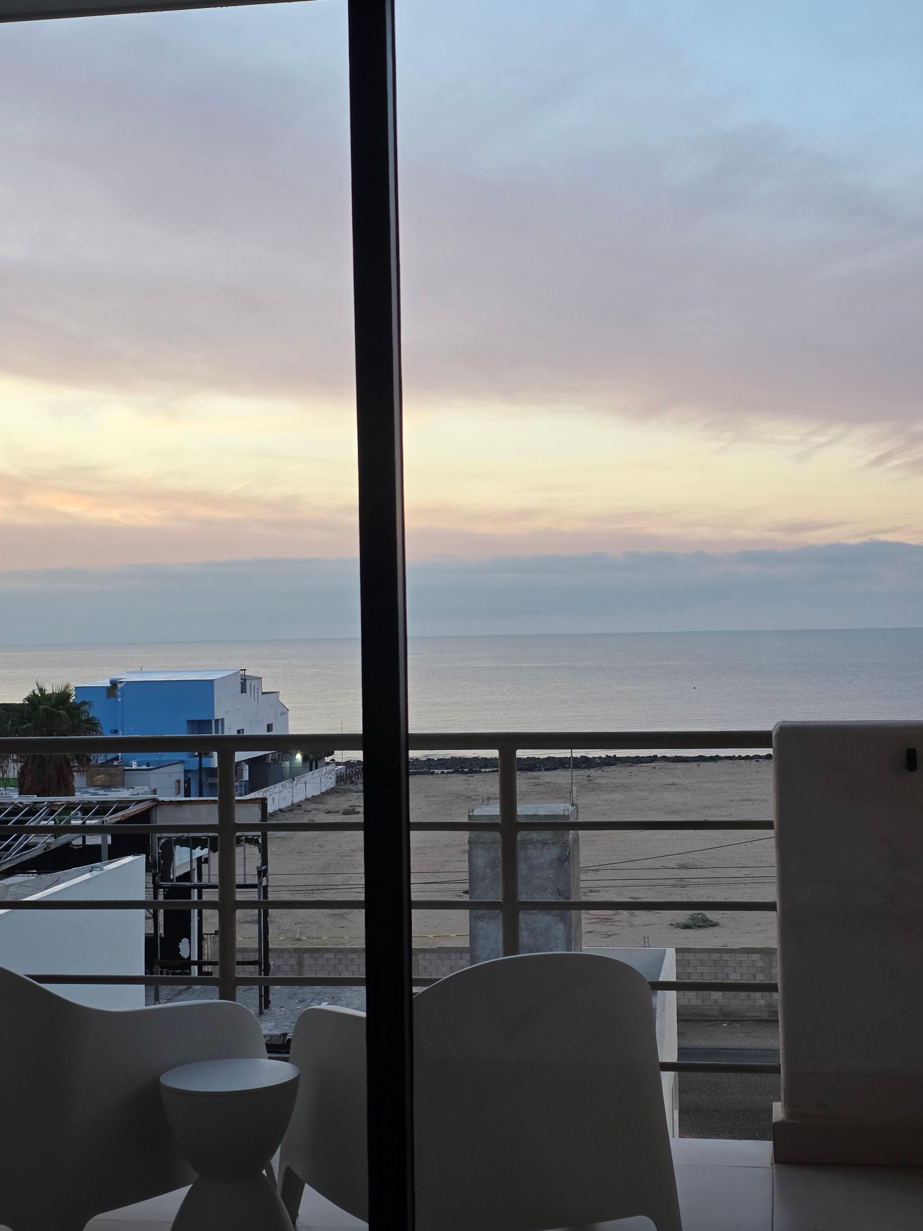 View of sunrise from bed