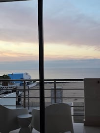 View of sunrise from bed