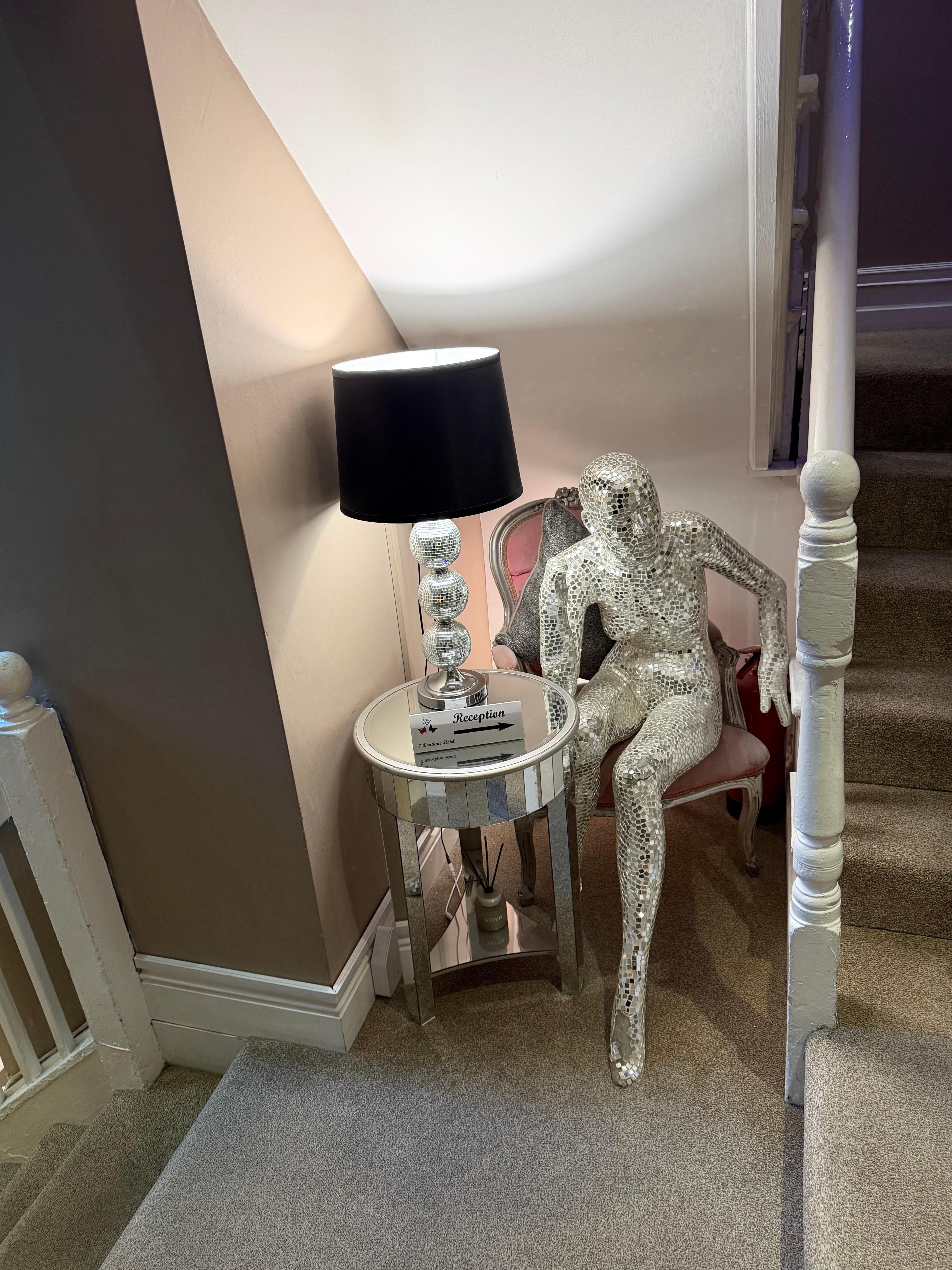 Landing between floor with our room and reception.