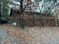 The back of the cabin facing the road