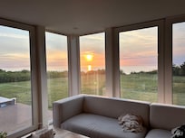 Taken from the living room. Lots of doors and windows to enjoy from inside.