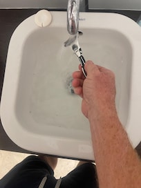 These are pictures showing the sink would not drain in the primary bathroom.