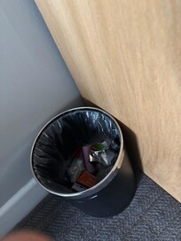 Trash was not removed from room upon check-in.