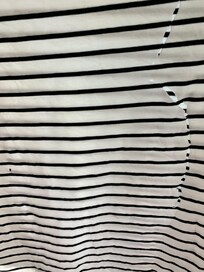 Holes in a shirt once removed from the dryer. We didn’t use it again. Instead washed clothes and hung them to dry.