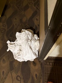 Soiled linen on hallway floor outside our room.