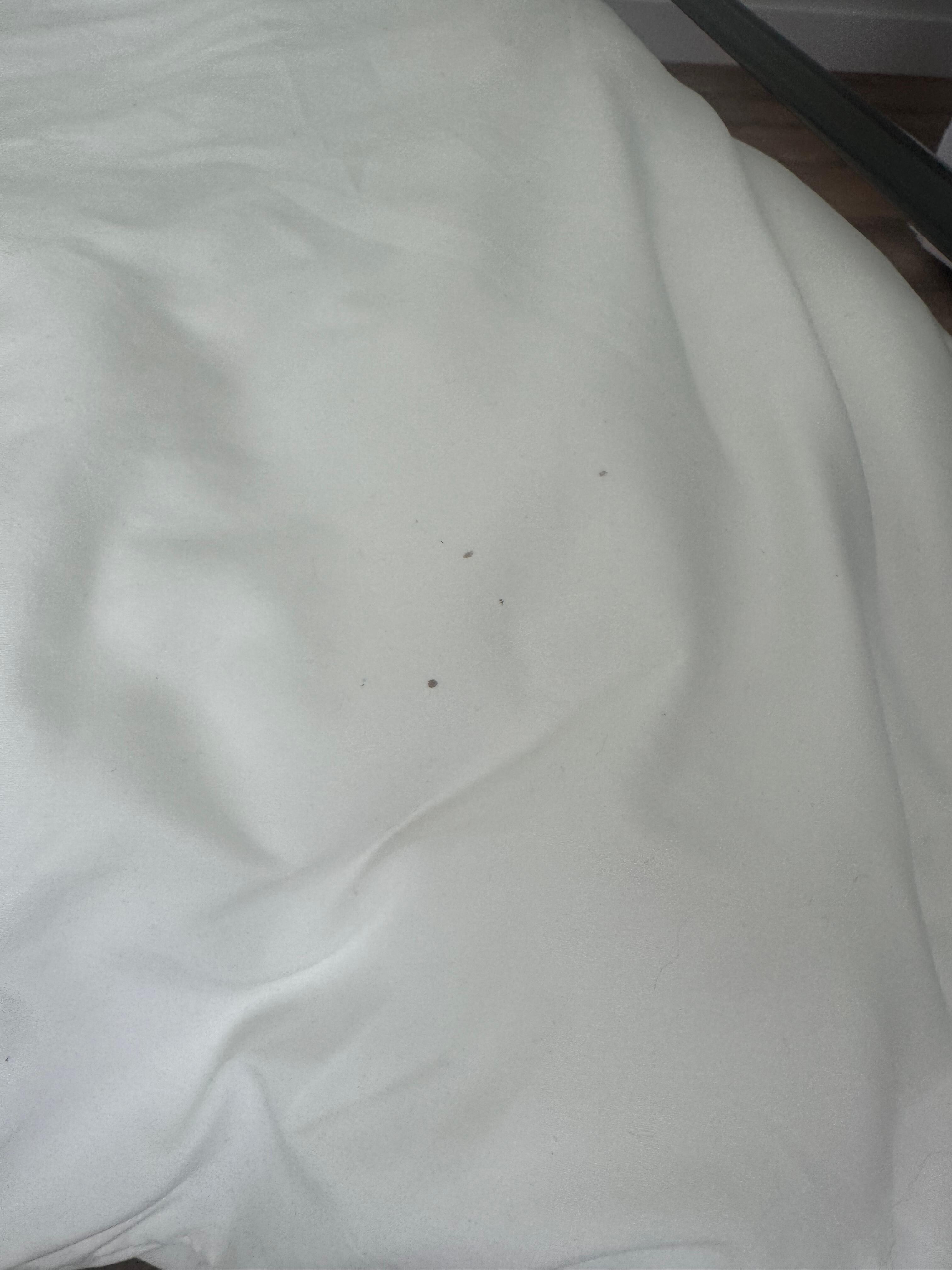 One bed with stained sheets