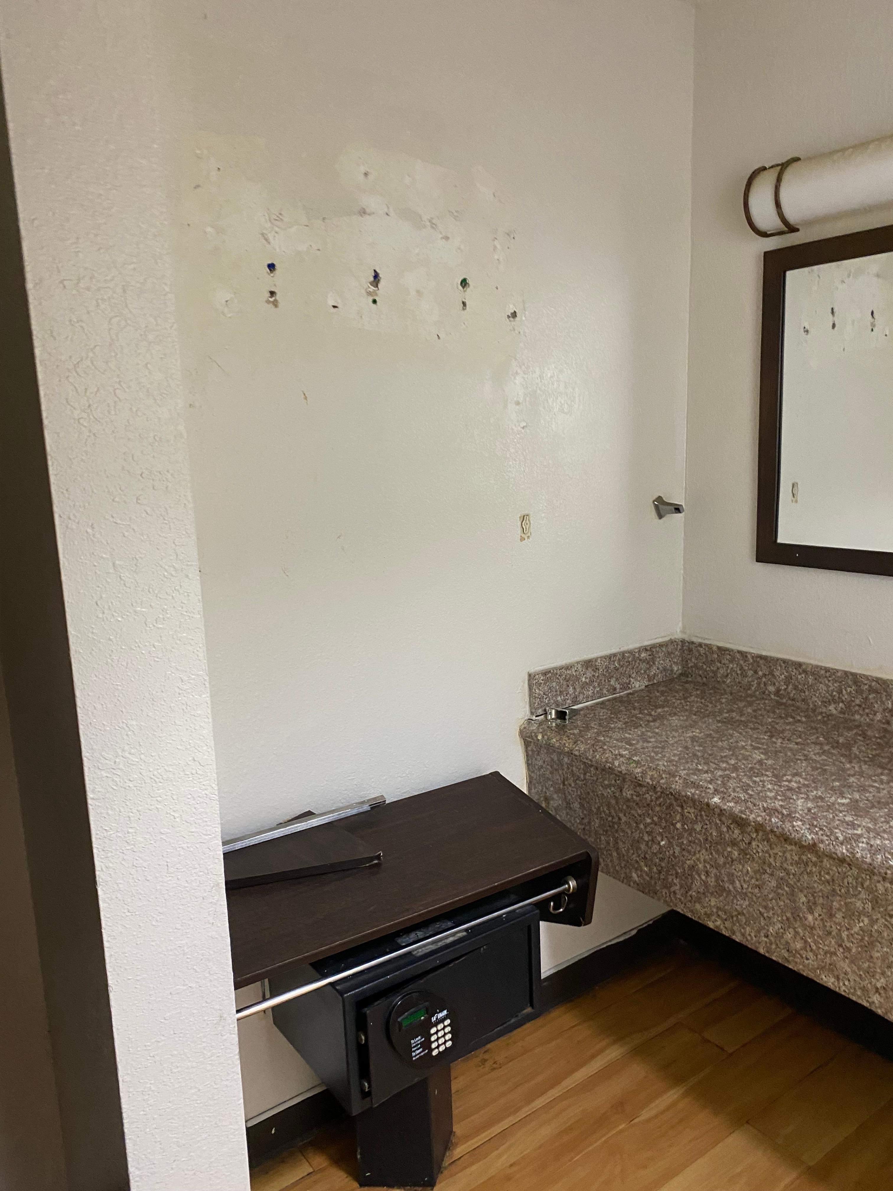 Shelf fell off wall and was just sitting on the floor