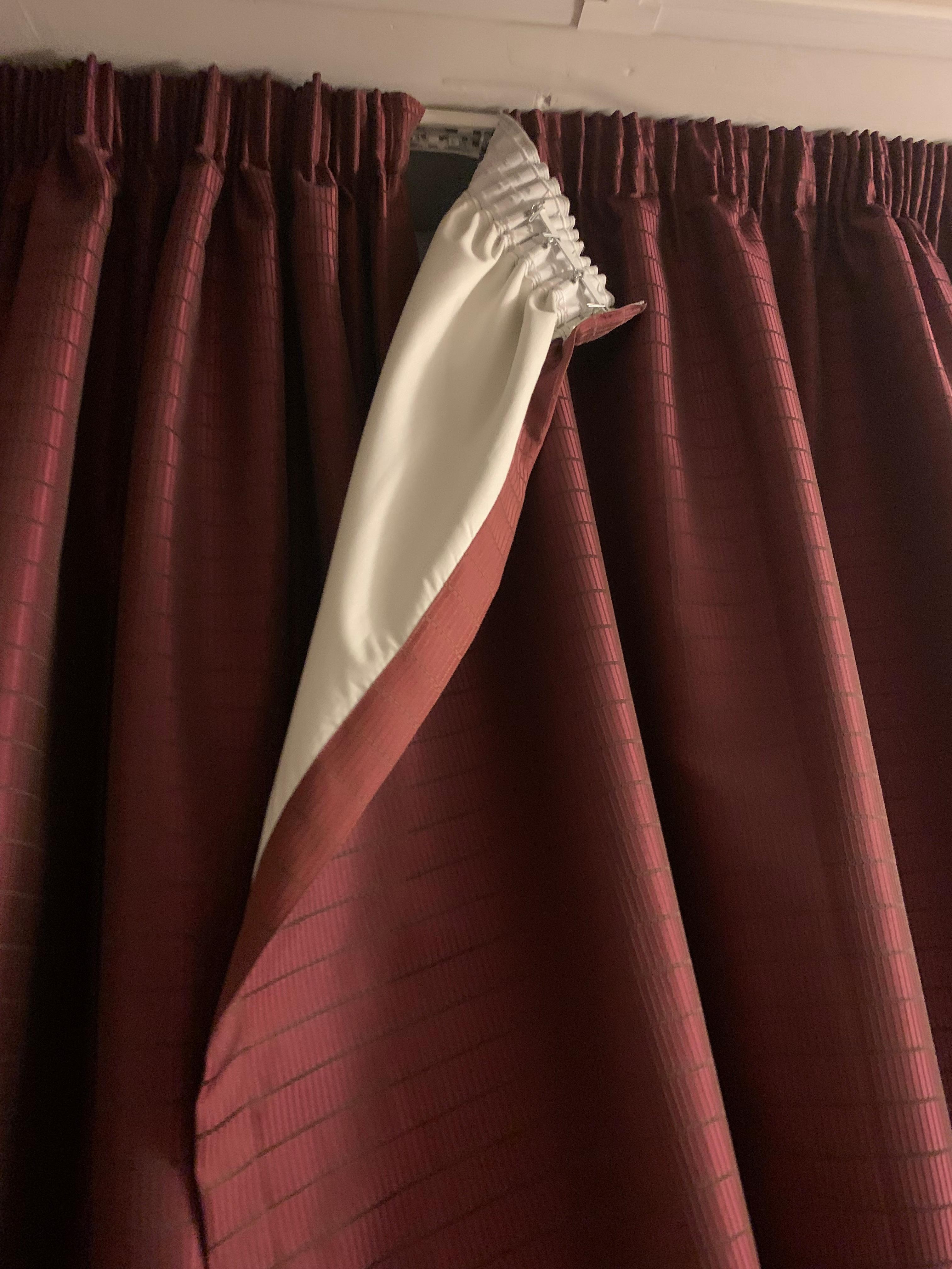 Curtains hanging off