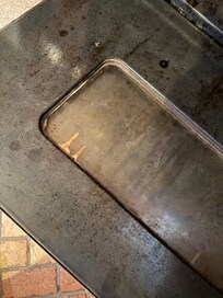 Oven door is very dirty.