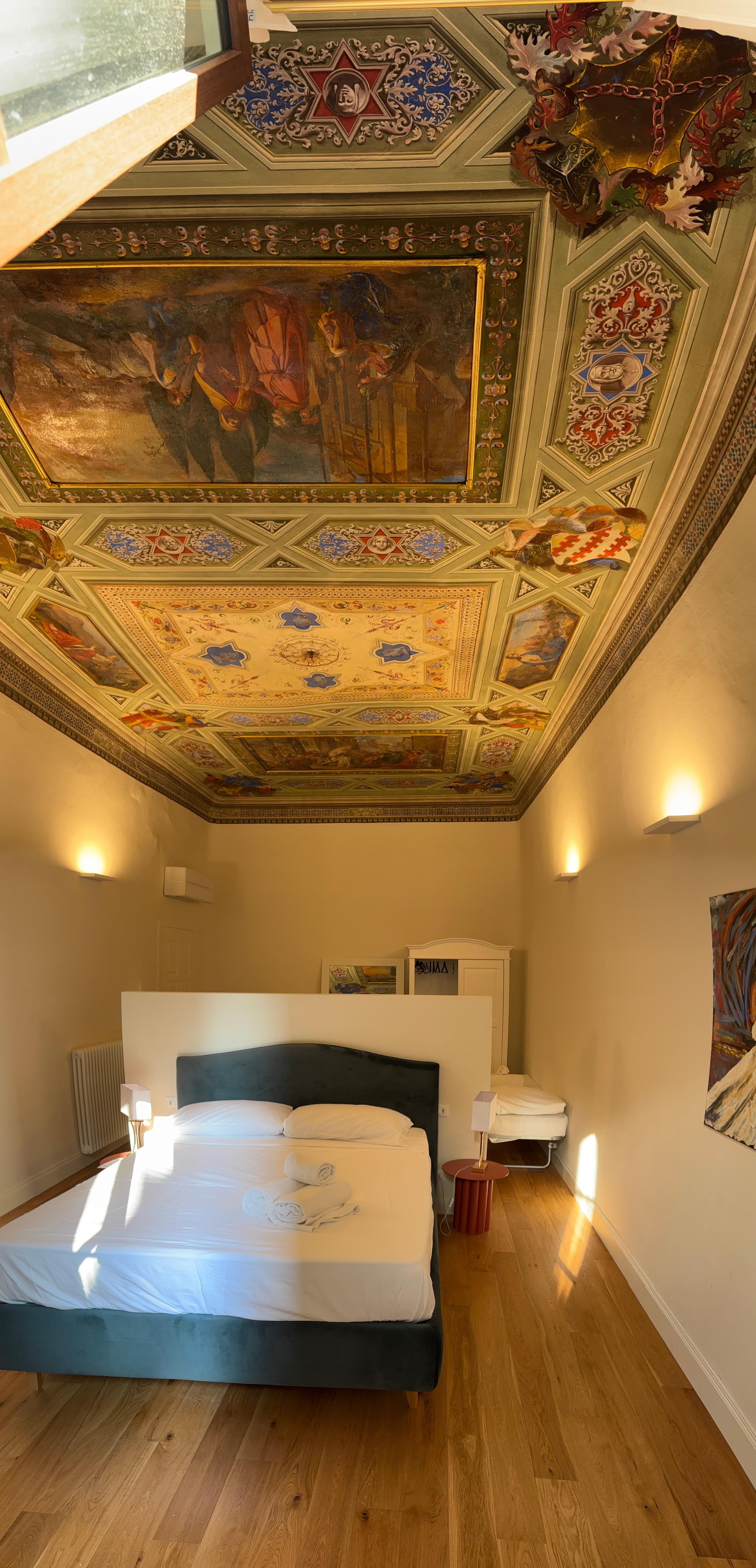 Bedroom with awesome fresco on ceiling.