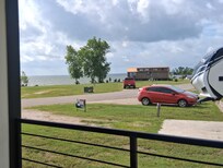 To the left of porch