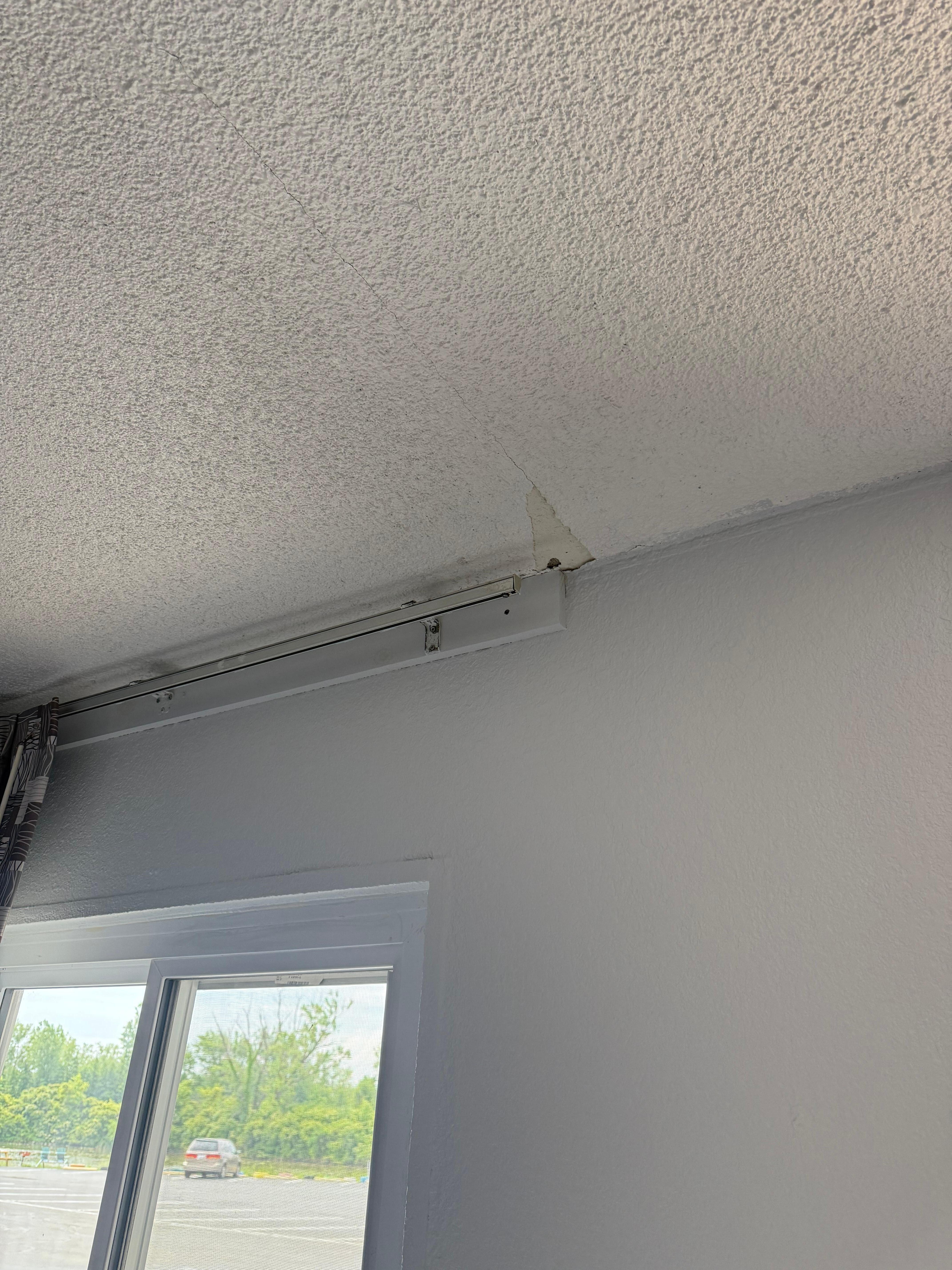 Ceiling pieces falling - terrible odor in room- absolutely gross 